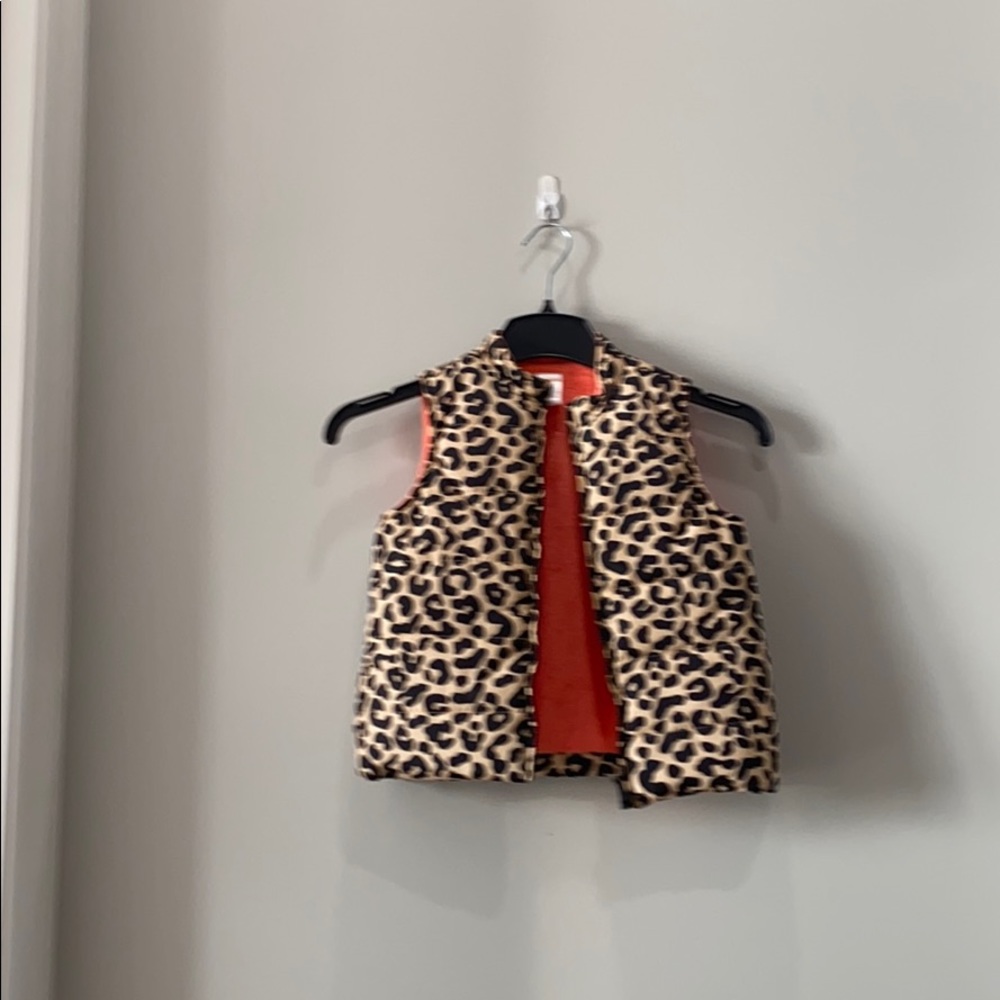 It is a cheetah vest it is Black and Tan